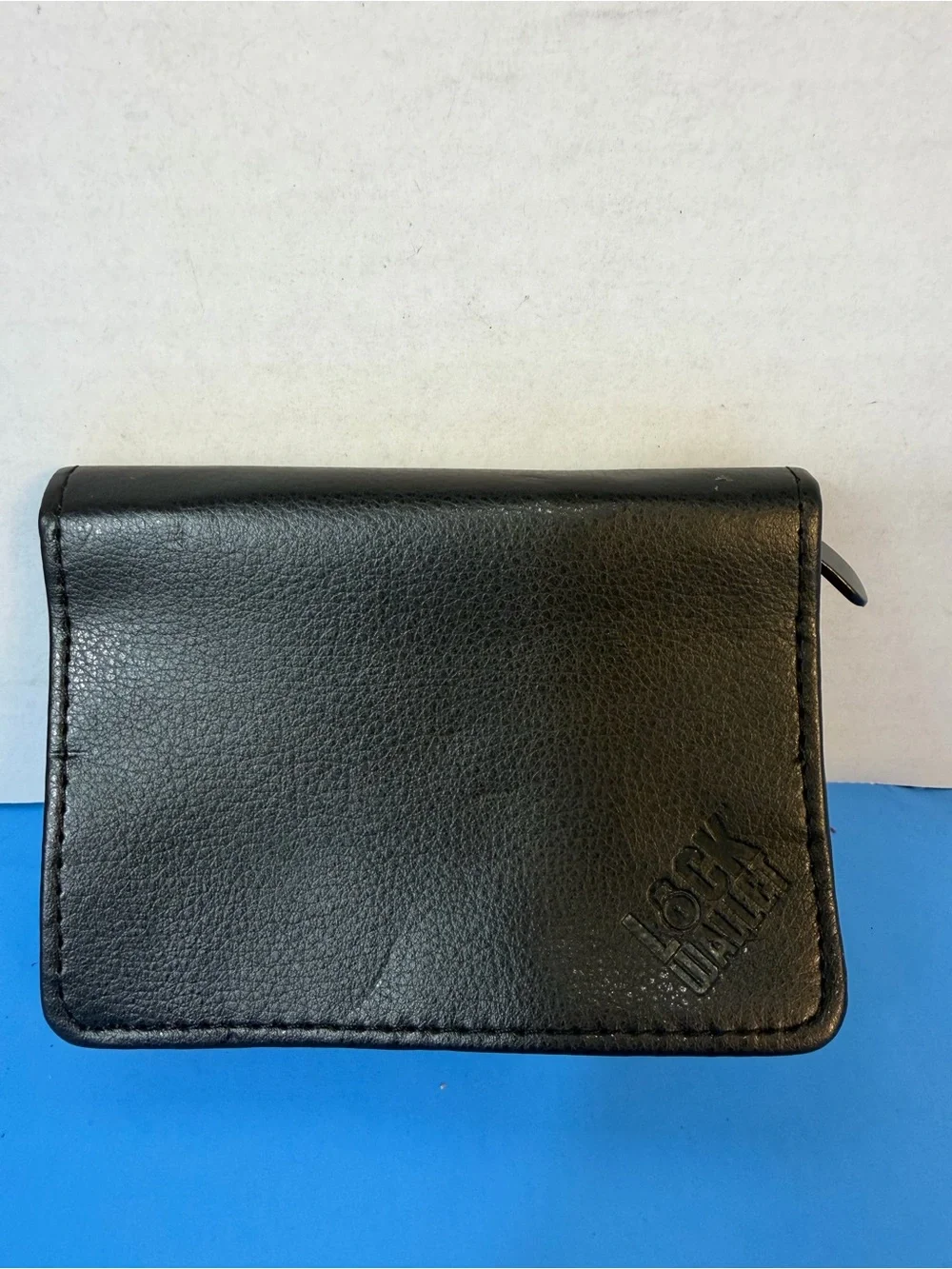 Black Leather Bi-Fold Wallet with Embossed Logo